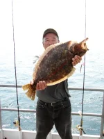 man-with-fluke2-1_John-Chisholm-MA-DMF-scaled.webp