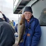 Leslie with baccala dinner.webp